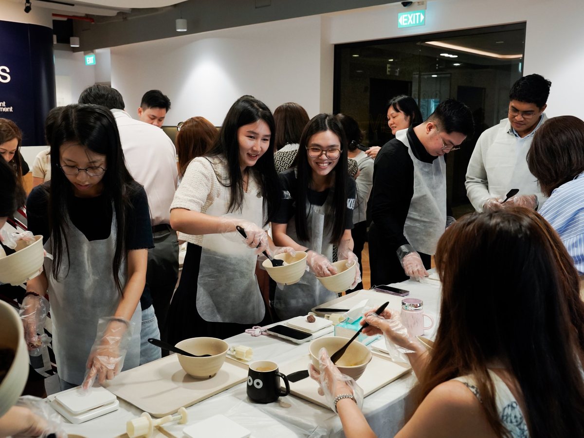 Office team making no-bake snacks together at a hands-on workshop in Singapore